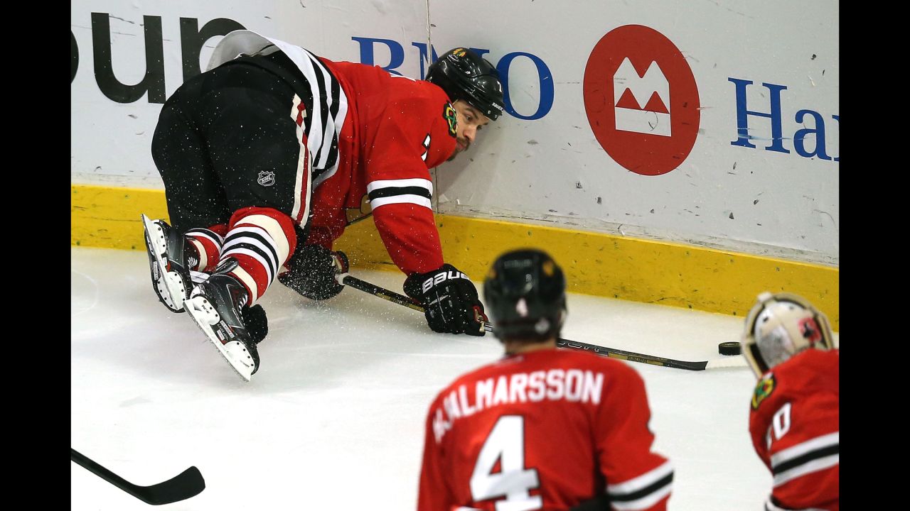 Brent Seabrook of the Chicago Blackhawks crashes into the board.