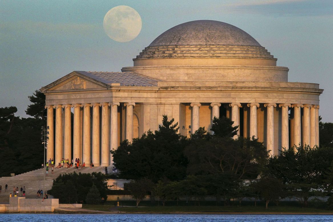 A full moon rises behind the Jefferson Memorial in Washington on June 22. 