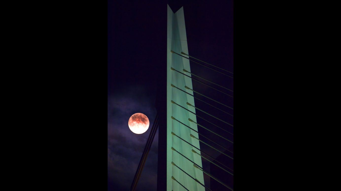 The moon hangs in the sky over Rotterdam, the Netherlands, on June 22. <a href="http://ireport.cnn.com/topics/993442">Share your Supermoon stories.</a>