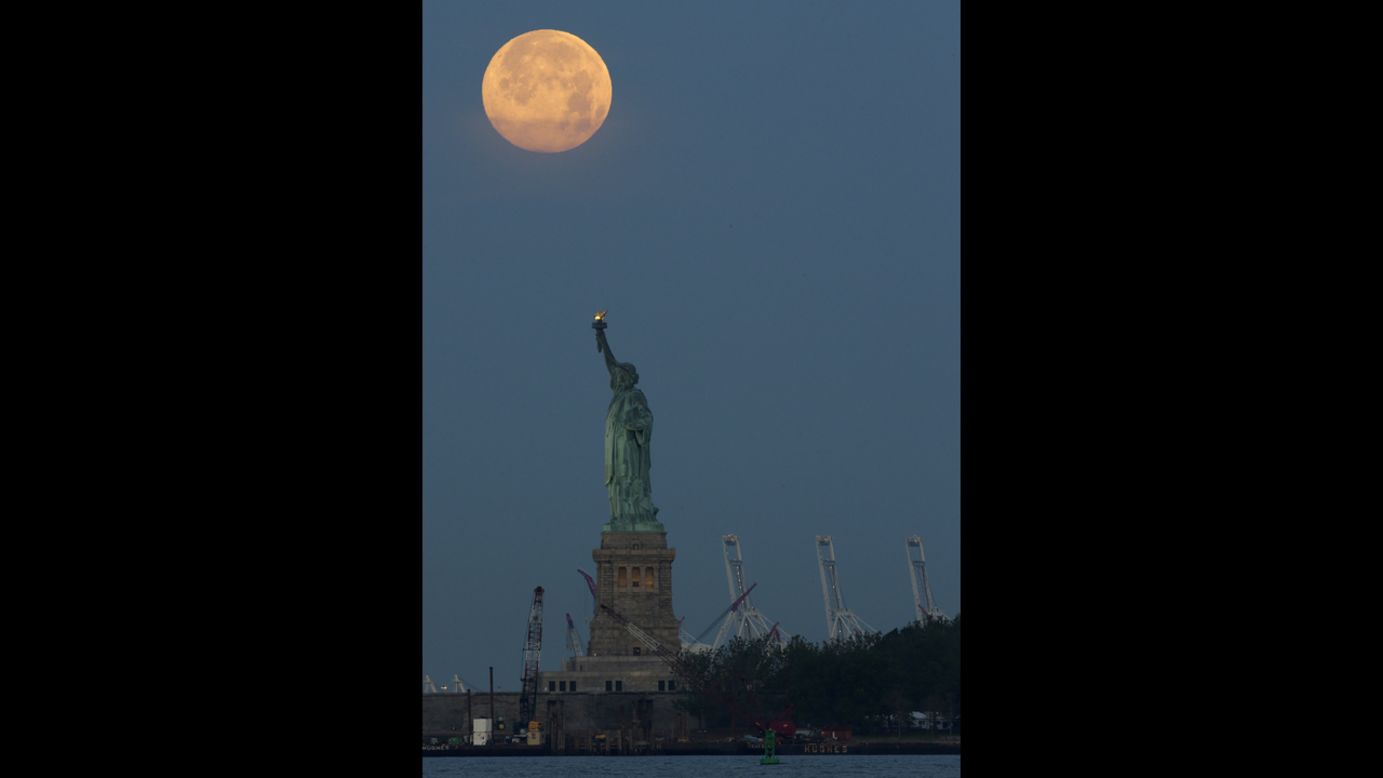 The Supermoon is seen over the Statue of Liberty on June 23 in New York. 