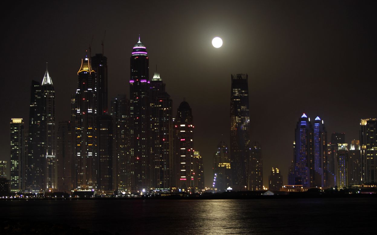  The supermoon is seen behind the Marina district towers in Dubai, United Arab Emirates, on June 23.
