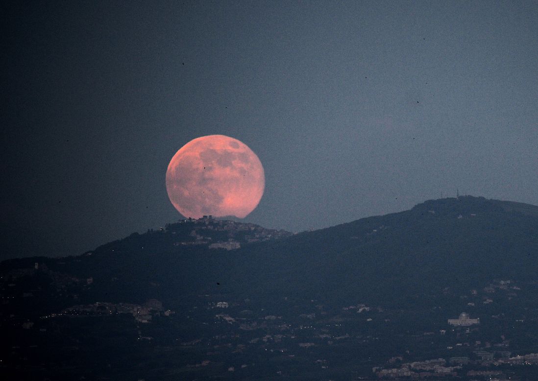 The supermoon rises over Rome on June 23.