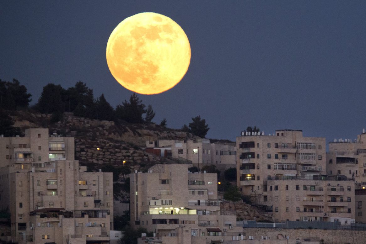 The biggest and brightest moon of the year rises over a Jerusalem neighborhood on Sunday, June 23. The magic moment happened early June 23, 2013, when<a href="http://www.cnn.com/2013/06/22/us/supermoon-sunday/index.html"> the moon was at the closest point to Earth in its orbit</a>.  A supermoon, which occurs once a year, is 14% larger and 30% brighter than most full moons, <a href="http://moon.nasa.gov/newsdisplay.cfm?Subsite_News_ID=44049&SiteID=6&iSiteID=1" target="_blank" target="_blank">according to NASA</a>.