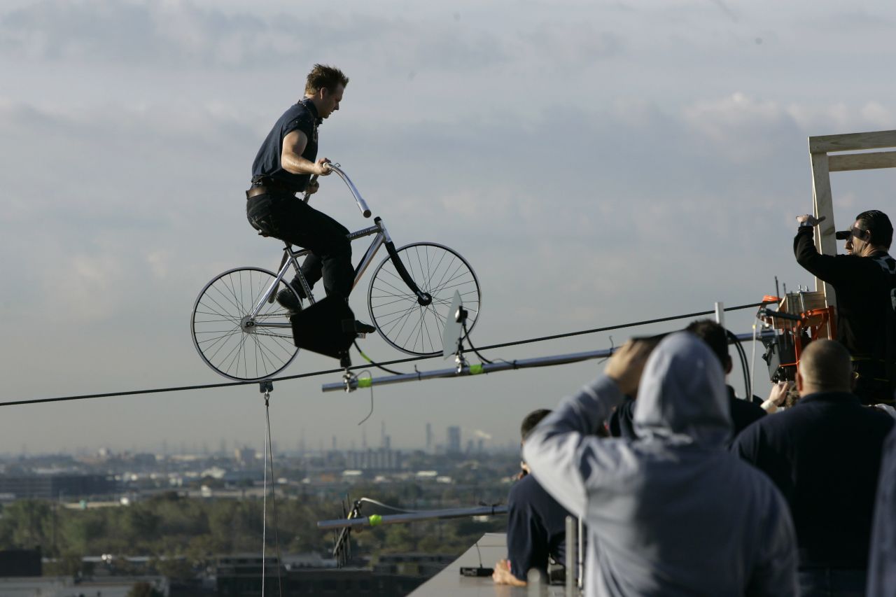 Wallenda pedals to the end of a wire 12 stories above a Newark, New Jersey, street in October 2008. He earned the <a href="http://www.worldrecordacademy.com/stunts/highest_and_longest_bike_ride-Nick_Wallenda_sets_world_records_80407.htm" target="_blank" target="_blank">Guiness World Record</a> for the longest distance and greatest height traveled by bicycle on a high wire when he traveled 235 feet at a height of 135 feet.