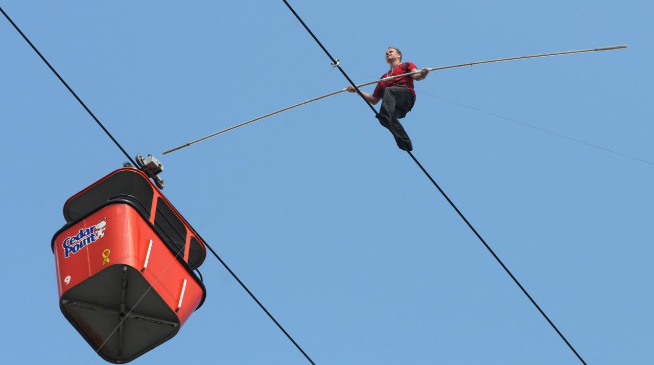 Wallenda walks one of the Sky Ride cables at the Cedar Point amusement park in Sandusky, Ohio, in July 2009.