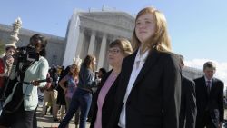 FILE - In this Oct. 10, 2012 file photo, Abigail Fisher, right, who sued the University of Texas, walks outside the Supreme Court in Washington. The Supreme Court has sent a Texas case on race-based college admissions back to a lower court for another look. The court's 7-1 decision Monday leaves unsettled many of the basic questions about the continued use of race as a factor in college admissions. (AP Photo/Susan Walsh, File)