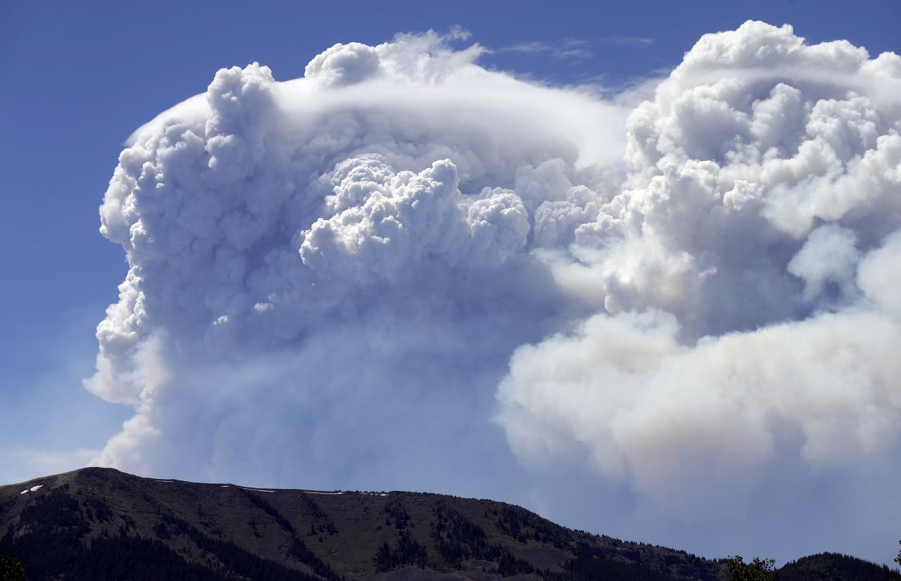 Plumes of smoke rise above Del Norte Peak in Colorado on Sunday, June 23. Fires have been burning across Colorado since early June.