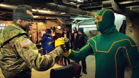 Jim Carrey, left, as Colonel Stars and Stripes and Aaron Taylor-Johnson as Kick-Ass in "Kick-Ass 2."