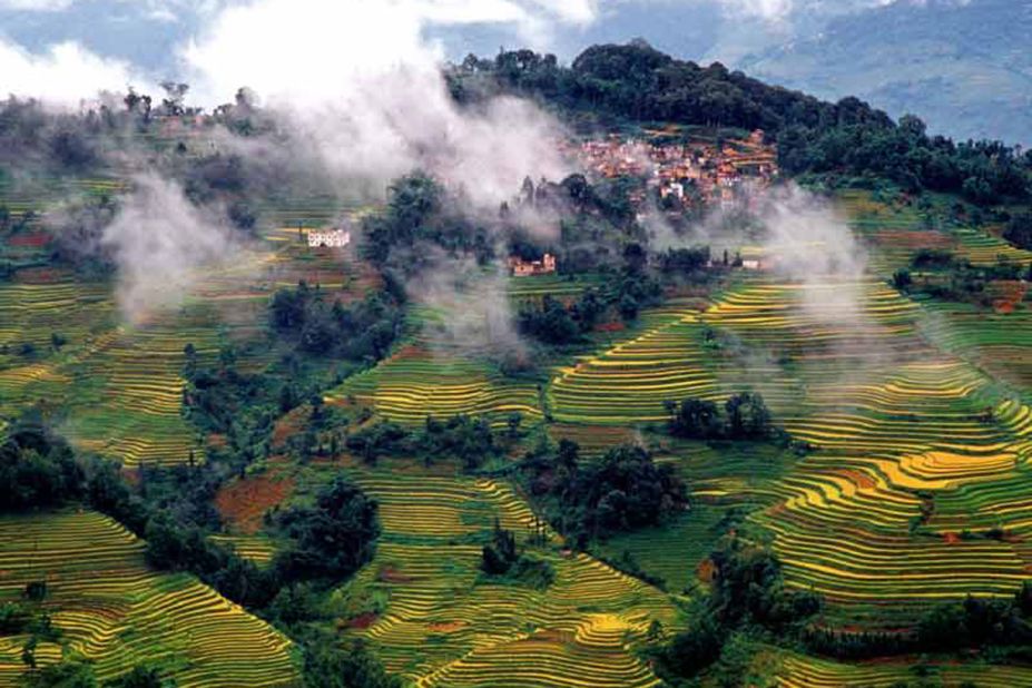 A 16,603-hectare site in Southern Yunnan, the Honghe Hani rice terraces stretch from the slopes of the Ailao Mountains to the banks of the Hong River. "Over the past 1,300 years, the Hani people have developed a complex system of channels to bring water from the forested mountaintops to the terraces," says UNESCO's Honghe Hani inscription. <br />