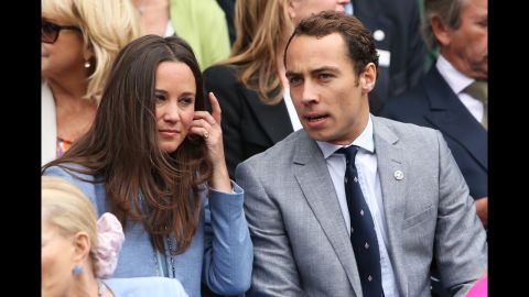 Pippa Middleton and James Middleton, siblings of Catherine, Duchess of Cambridge, talk during the match between Hanescu and Federer on June 24.