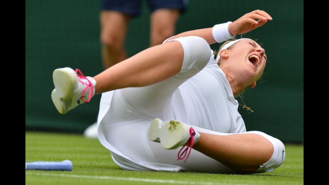 Victoria Azarenka of Belarus falls during a point against Portugal's Maria Joao Kohler during her first-round match on June 24. Azarenka won 6-1, 6-2.