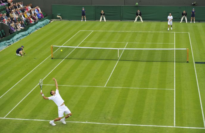 Croatia's Marin Cilic serves against Cyprus' Marcos Baghdatis on his way to victory in their first-round match on June 24. Cilic won 6-3, 6-4, 6-4.