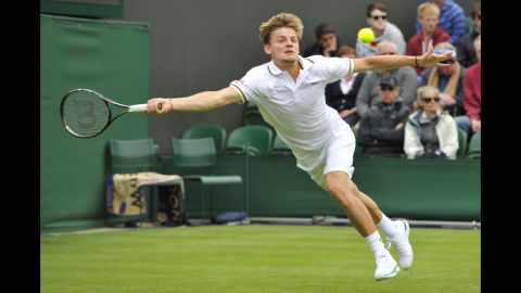 Belgium's David Goffin returns against France's Jo-Wilfried Tsonga during their first-round match on June 24. Tsonga won in straight sets 7-6, 6-4, 6-3.