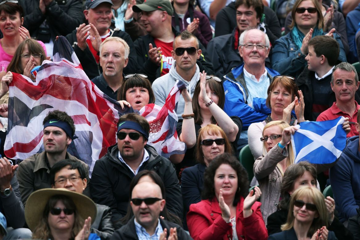 Fans cheer for Andy Murray of Great Britain during his first-round match against Benjamin Becker of Germany on June 24.