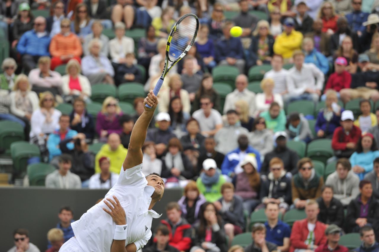 Tsonga serves against Goffin during their first-round match on June 24.
