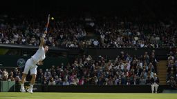 Britain's Andy Murray serves against Germany's Benjamin Becker during their first-round match on the first day of the Wimbledon Lawn Tennis Championships in London on Monday, June 24.