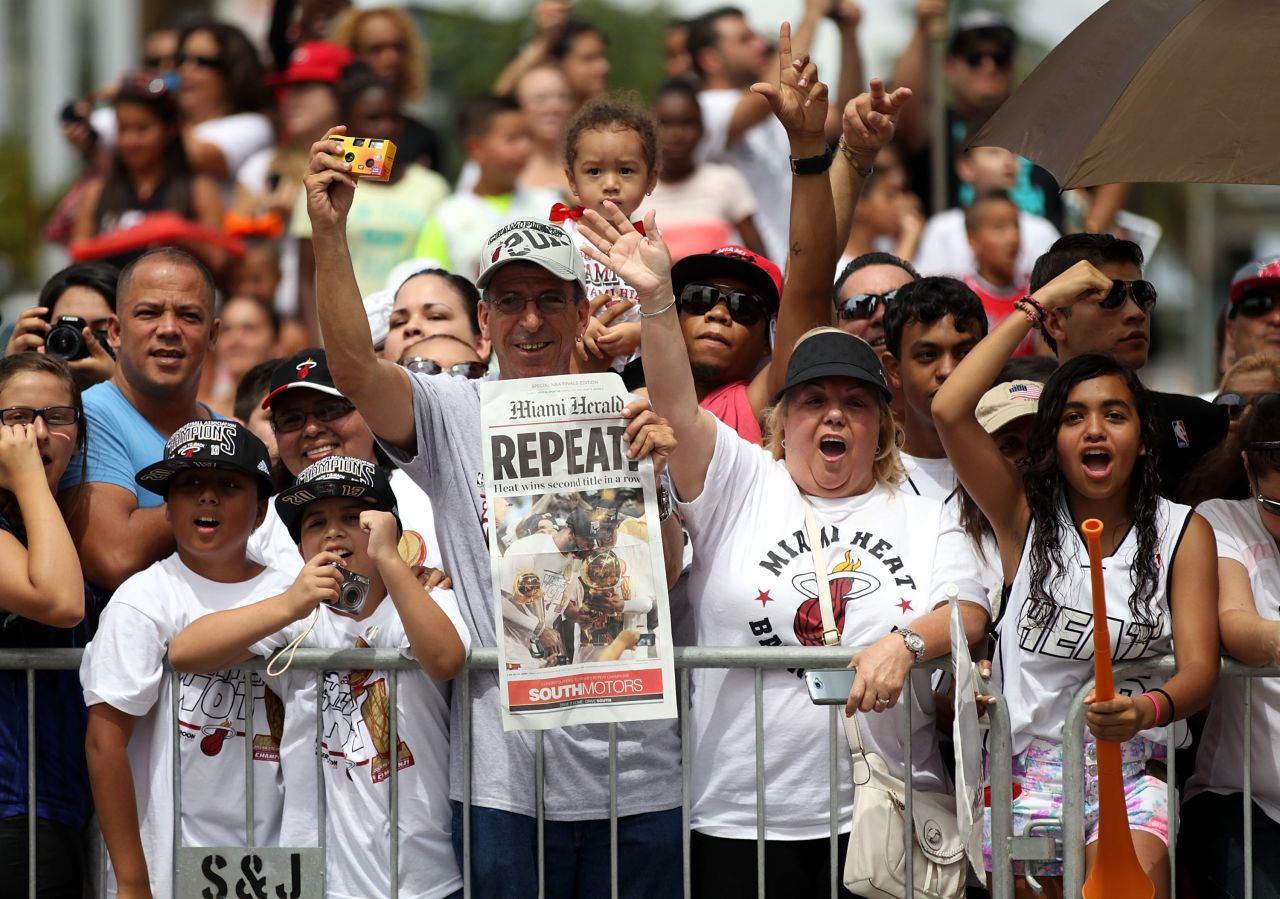 Fans cheer as players ride by in the championship parade. The event attracted an estimated crowd of 400,000.