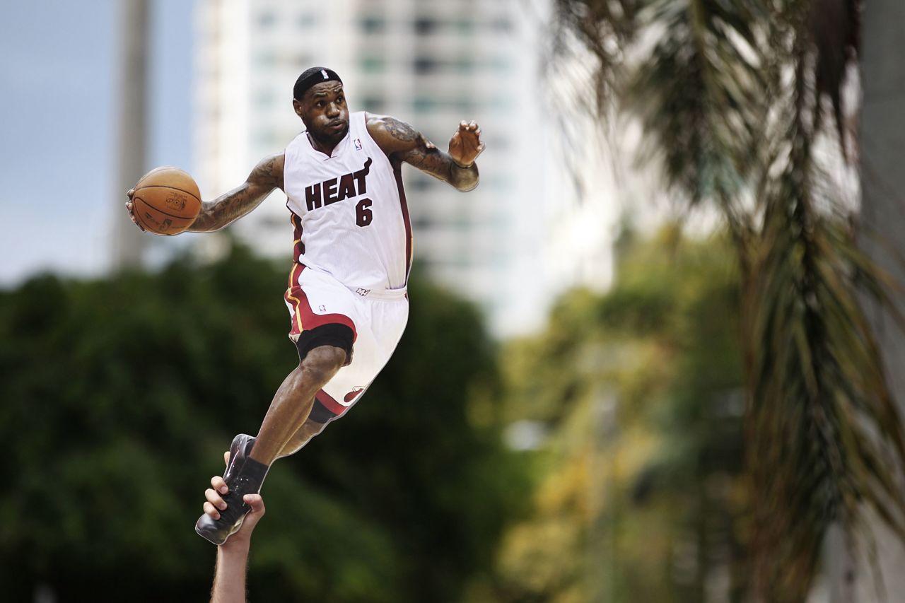 A fan holds up a cutout of LeBron James.