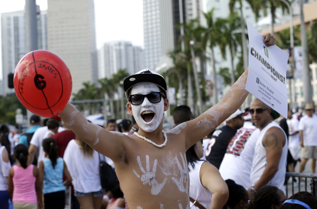 Heat fan Danny Garcia cheers during the victory parade in Miami.