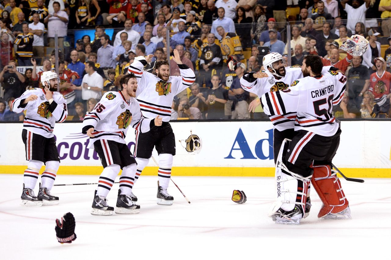 The Chicago Blackhawks celebrate on the ice after defeating the Boston Bruins in Game 6.