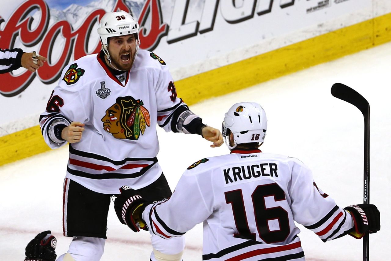 Dave Bolland of the Chicago Blackhawks celebrates with Marcus Kruger after scoring the game-winning goal late in the third period.