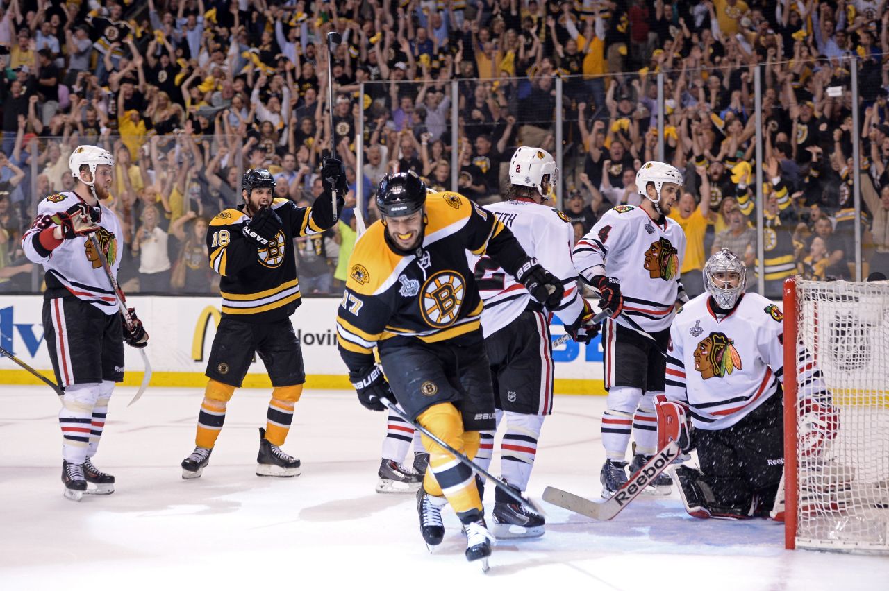 Lucic, center, celebrates his goal in the third period that gave the Bruins a 2-1 lead.