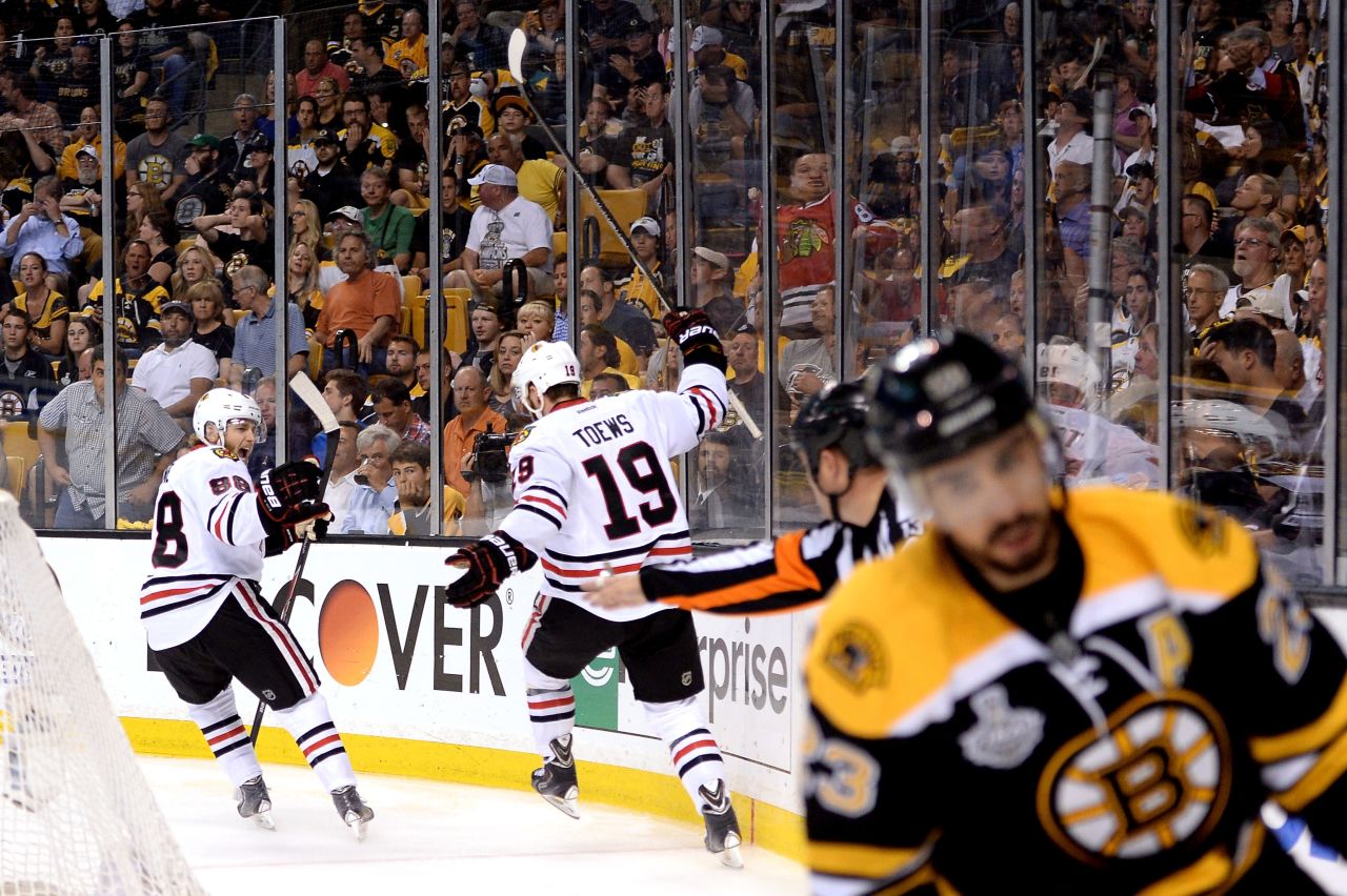 Jonathan Toews of the Chicago Blackhawks celebrates with teammate Patrick Kane after Toews scored a goal in the second period.