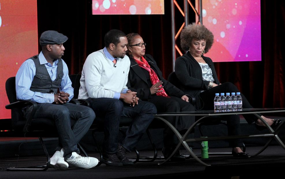 From left, Kweli, filmmakers Shukree Hassan Tilghman and Sharon La Cruise and activist Angela Davis at a Black History Month panel last year. The rapper often addresses the plight of African-Americans in his songs, once rhyming, "N****s with knowledge is more dangerous than n****s with guns/They make the guns easy to get and try to keep n****s dumb."