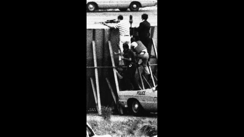 In 1971, a hijacker, tentatively identified as Richard Oberfell of Passaic, New .Jersey, forced a Chicago-bound plane to land at New York's LaGuardia Airport. He then took two hostages in a maintenance truck on a nine-mile ride to JFK international airport. There, FBI agents climbed a protective wall as they hunted down the hijacker, who demanded a plane to take him to Italy. FBI agent Kenneth Lovin, dressed in a striped shirt, fired fatal shots that killed the hijacker.