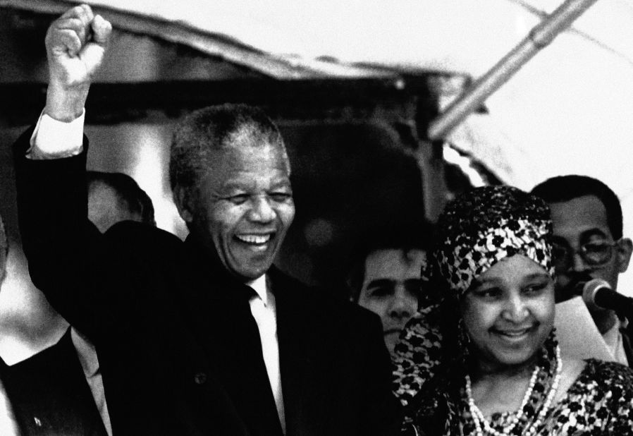 Mandela and his wife react to supporters during a visit to Brazil at the governor's palace in Rio De Janeiro, on August 1, 1991.