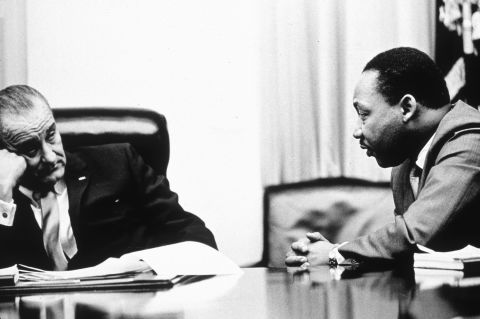 President Lyndon Johnson, pictured here discussing the act with the Rev. Martin Luther King Jr. in 1965, went on national television to call for passage of the Voting Rights Act. He ended his speech by saying, "And we shall overcome."