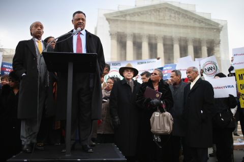 The Rev. Jesse Jackson, at the microphone, and the Rev. Al Sharpton, left, deliver remarks during a rally outside the U.S. Supreme Court on February 27, 2013, as the court prepared to hear oral arguments in Shelby County v. Holder, the legal challenge to Section 5 of the Voting Rights Act. 