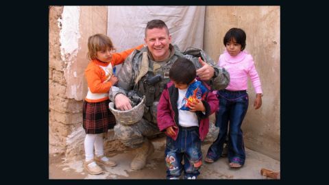 Col. Kevin Brown with Iraqi kids in Kirkuk in 2007. Brown helped ensure Baby Noor came to the U.S. for medical help.
