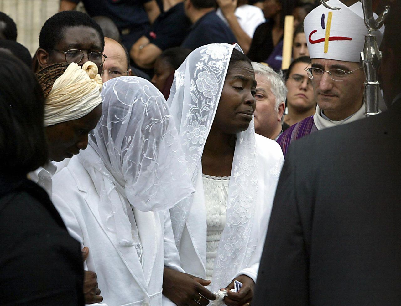 Marc-Vivien Foe's widow Marie-Louise, pictured at her late husband's funeral in the French city Lyon, has been at odds with the former Cameroon international's father Martin. 