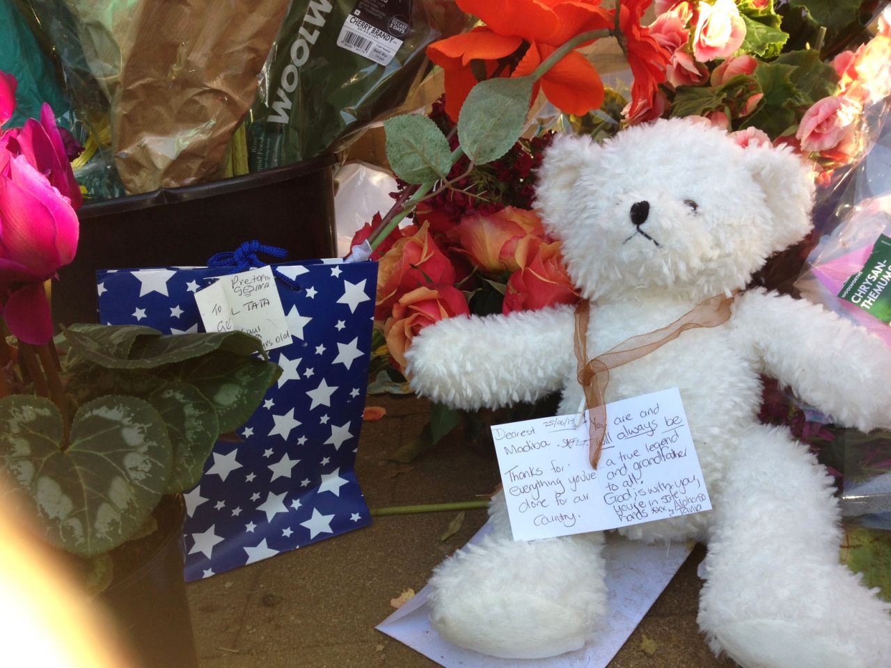A note, seen on June 26, tied around the neck of a teddy bear reads: "Thanks for everything you've done for our country."