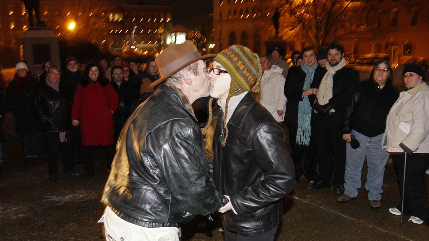 Olin Burkhart, left, and Carl Burkhart kiss on the steps of the New Hampshire Capitol on January 1, 2010, after the state's law allowing same-sex marriage went into effect.