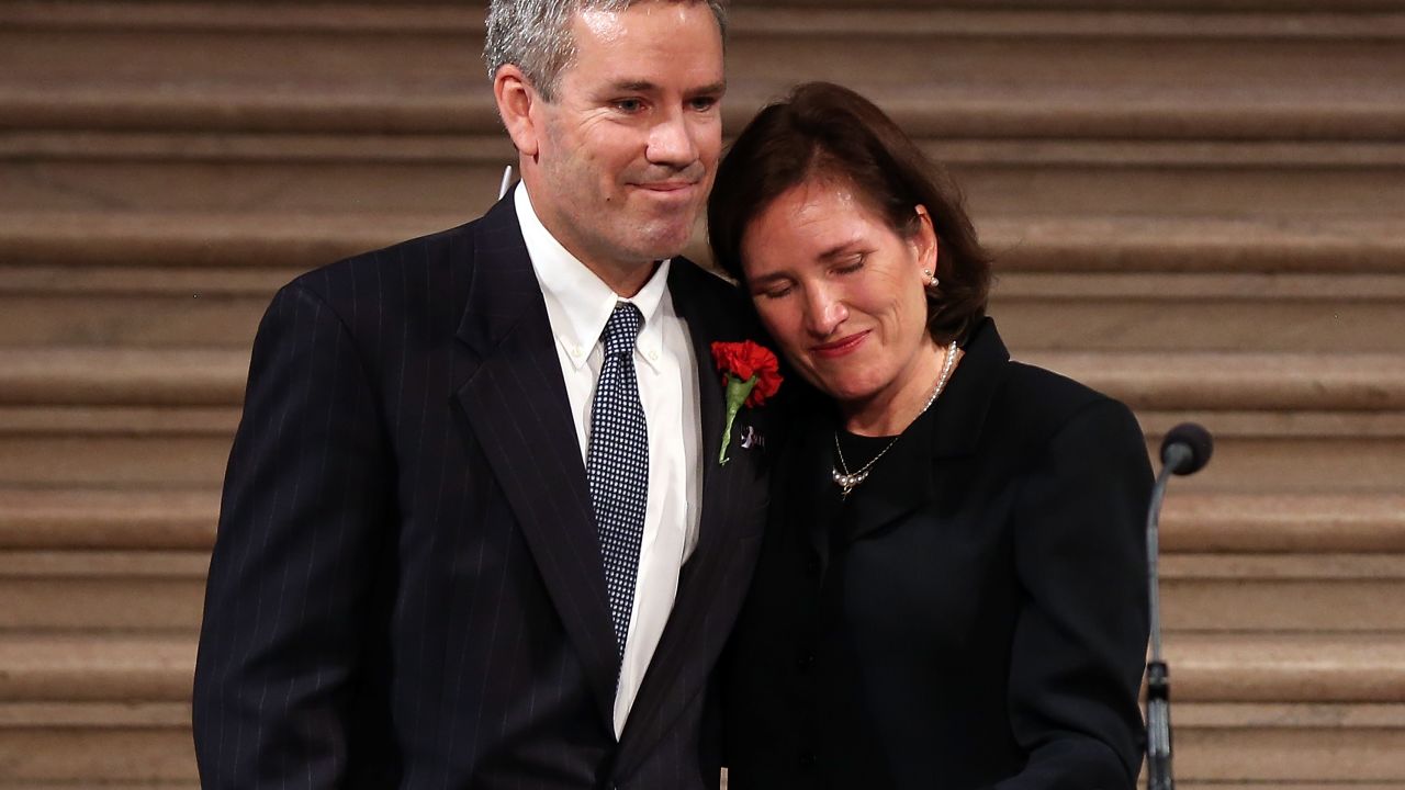 Anne Stevens Sullivan and Tom Stevens, siblings to former Ambassador Christopher Stevens, embrace during a memorial service for Stevens at San Francisco City Hall on October 16, 2012 in San Francisco, California.