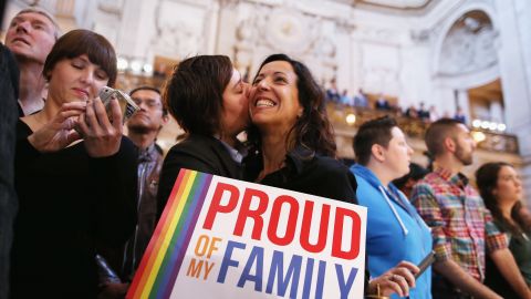 A couple celebrates at San Francisco City Hall upon hearing about the U.S. Supreme Court rulings on same-sex marriage on June 26, 2013. The high court cleared the way for same-sex couples in California to resume marrying after dismissing an appeal on Proposition 8 on jurisdictional grounds. The court also struck down a key part of the Defense of Marriage Act, a 1996 federal law defining marriage as between a man and a woman. 