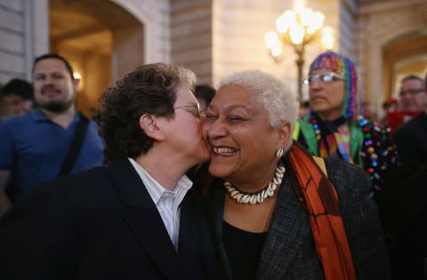 A couple celebrates at City Hall in San Francisco after hearing the Supreme Court struck down parts of the Defense of Marriage Act.