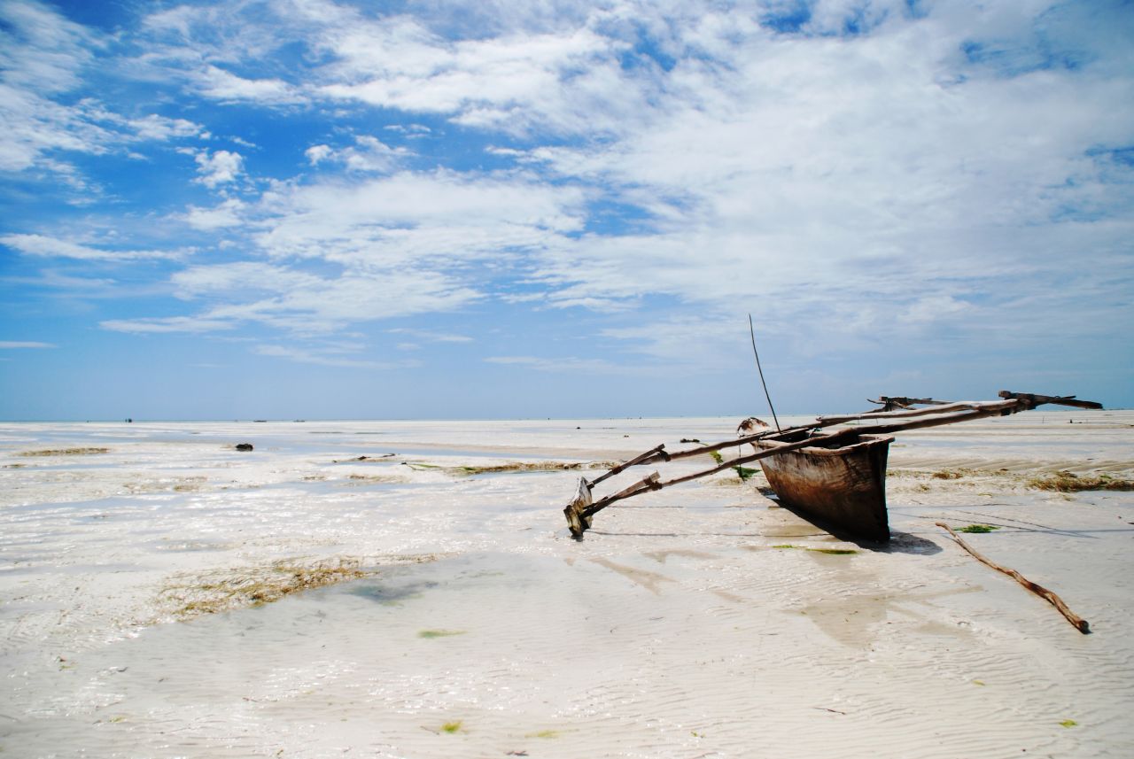 Zanzibar -- beloved by honeymoon couples, beach bums and Freddie Mercury fans. At low tide the azure waters at Paje Beach retreat for miles, leaving a landscape of silver sands punctuated by beached fishing boats.