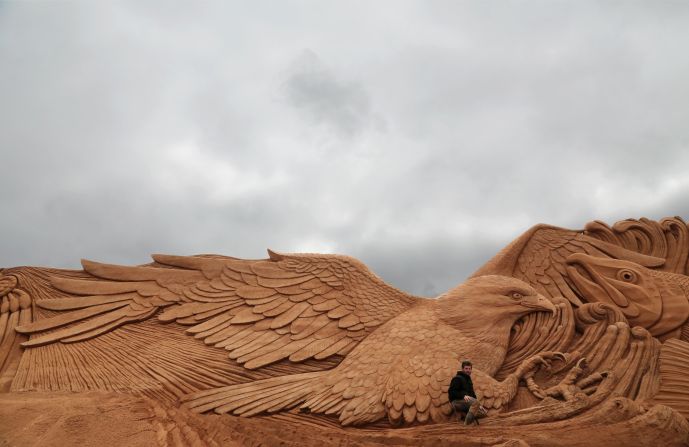 Marjon Katerberg poses with "Eagle Dance," at the<a href="http://www.sandskulptur.dk" target="_blank" target="_blank"> International Sand Sculpture Festival.</a>