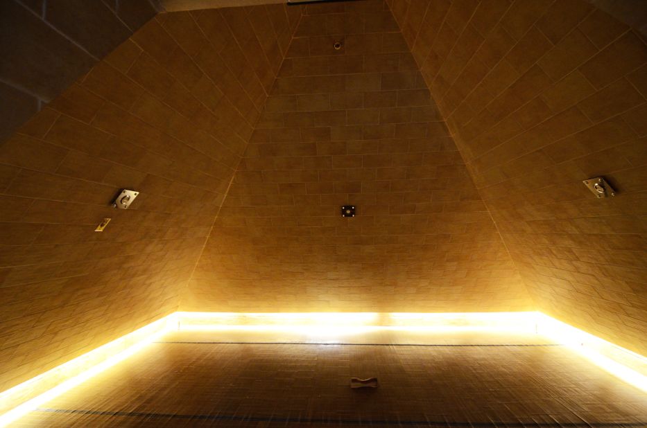 The walls of the pyramid room are set at a 52-degree angle, "which has been said to be the easiest angle to collect energies from the universe," according to the spa.