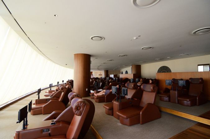 Each headrest in the relaxation room comes equipped with private speakers/headphones. There's also a movie room in the back with a big screen. 