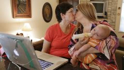 Julia Tate, left, kisses her wife, Lisa McMillin, in Nashville, Tennessee, after the reading the results of the Supreme Court rulings on same-sex marriage on Wednesday, June 26. The high court struck down key parts of the Defense of Marriage Act and cleared the way for same-sex marriages to resume in California by rejecting an appeal on the state's Proposition 8.