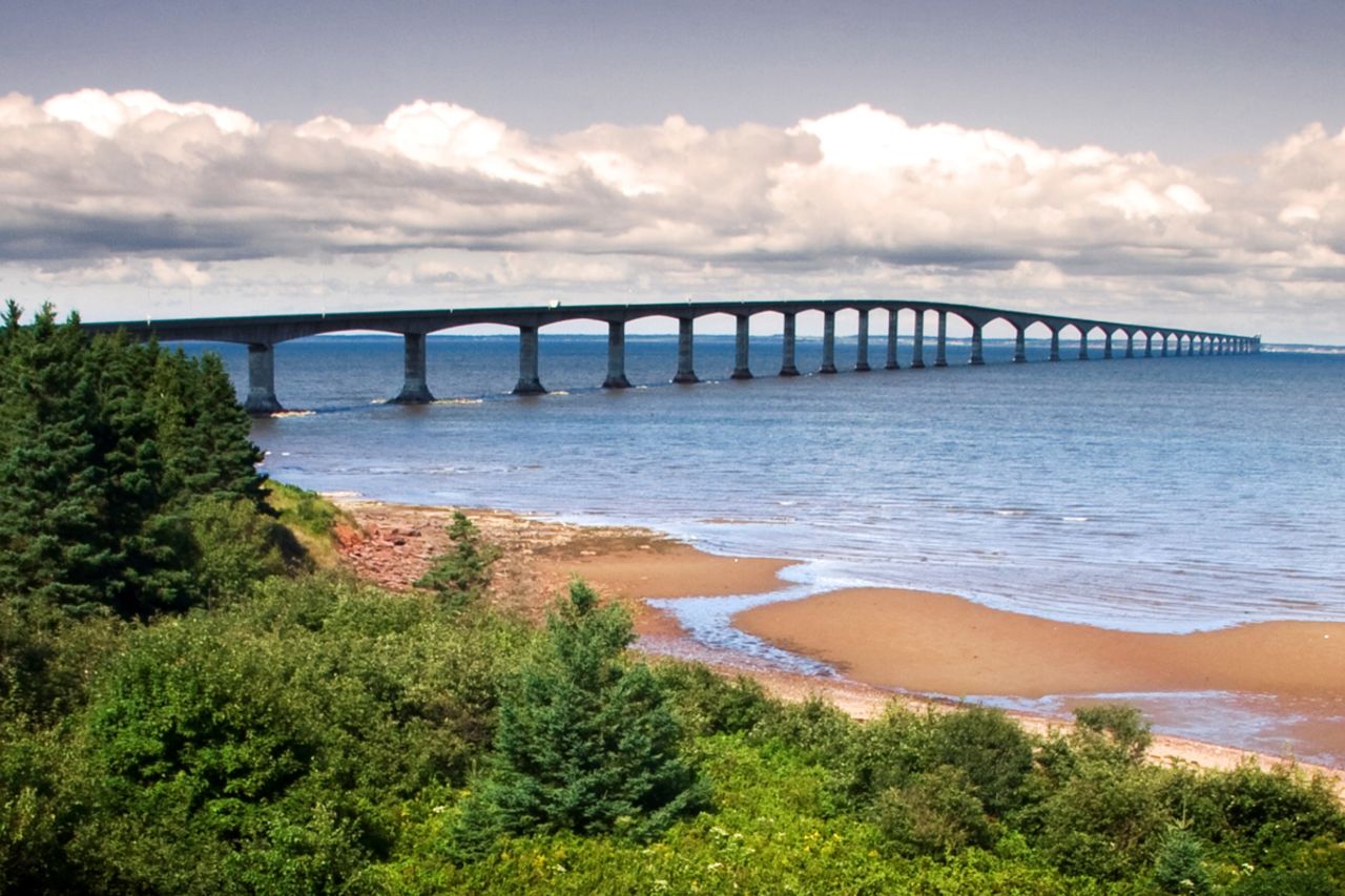 The bridge's curve is designed to help drivers stay alert. <br />Before construction of Confederation Bridge, the only way to reach Prince Edward Island from Canada's mainland was by ferry or airplane.<br />The wind, waves and snow that batter the bridge, which links Canada's smallest province with New Brunswick, forced engineers to come up with a concrete mix that was 60% stronger than most. A purpose-built floating crane, the Svanen, was used to maneuver the individual sections (which included 65 reinforced concrete piers) into place. <strong>Completion date:</strong> May 31, 1997.