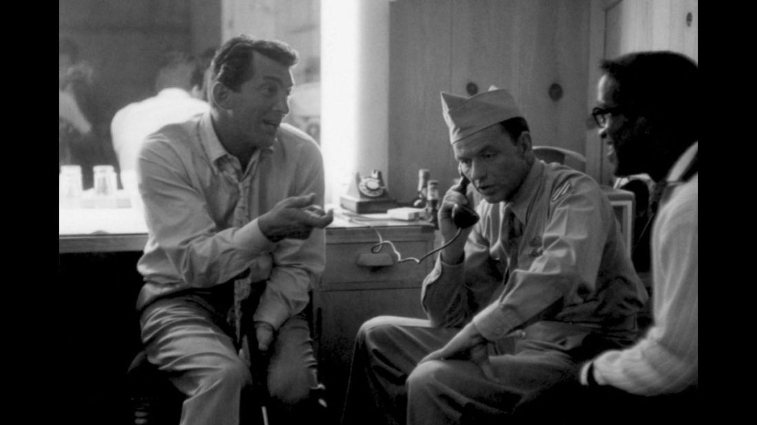 Davis Jr. visits Frank Sinatra and Dean Martin at MGM Studios, where the duo were making Some Came Running in 1958. The movie co-starred Rat Pack "mascot" Shirley MacLaine, who years later would affectionately describe her old friends as "primitive children who would put crackers in each other's beds and dump spaghetti on new tuxedos."
