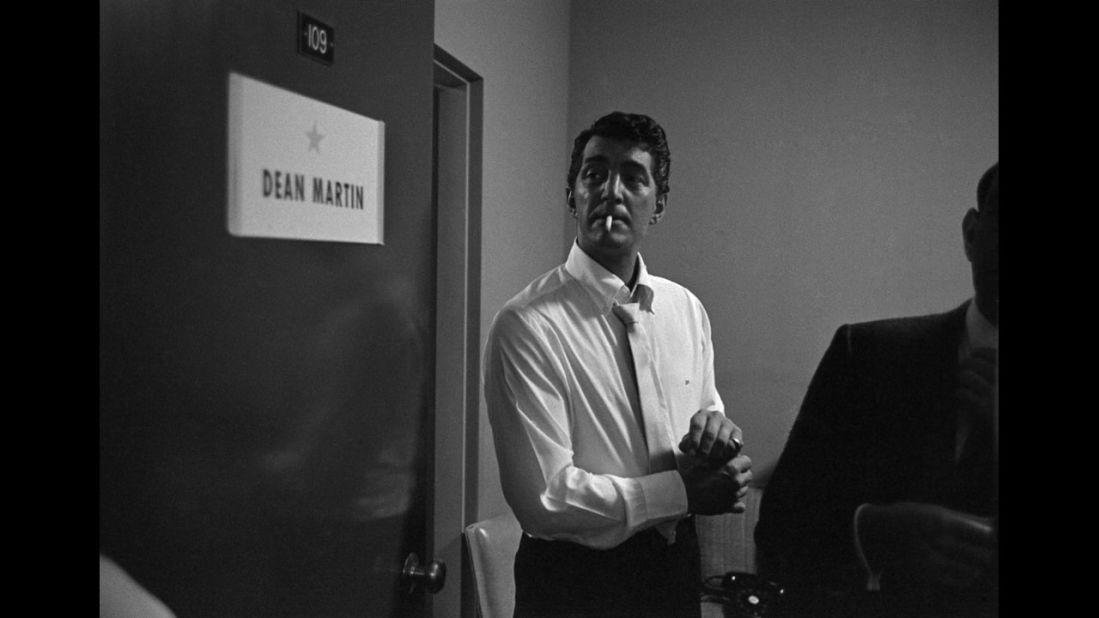 Dean Martin adjusts his cuff links backstage before a performance in Las Vegas in 1958.