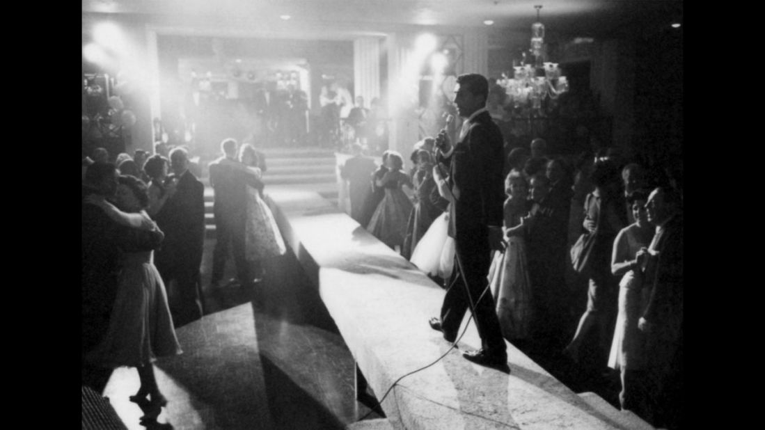 Dean Martin entertains a crowd in 1958.