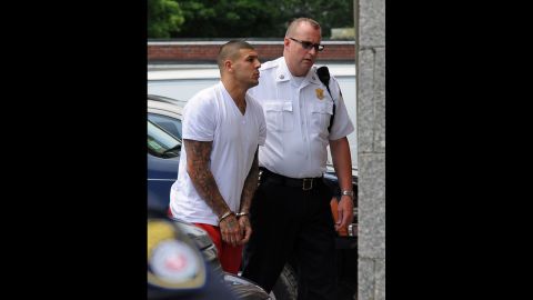 Hernandez is brought into the Attleboro, Massachusetts, District Court for his arraignment on June 26, 2013. He was charged with first-degree murder in Lloyd's death. Hernandez was released by his NFL team, the New England Patriots, less than two hours after his arrest.
