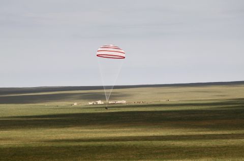 The return capsule of the Shenzhou 10 spacecraft lands in the grasslands of Inner Mongolia in northern China on June 26.